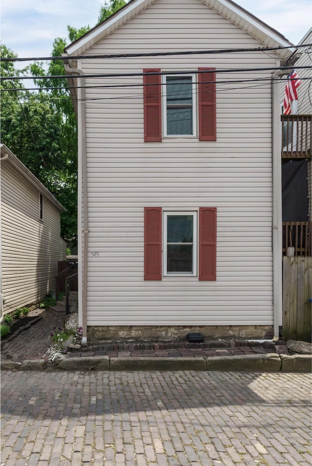 view of side of property featuring a patio