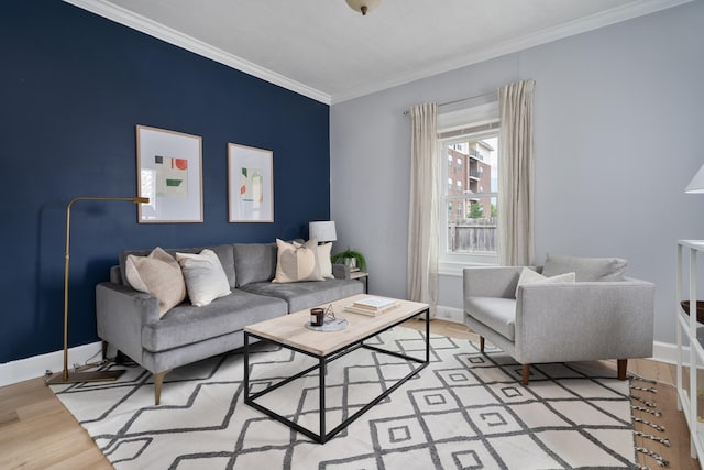 living room featuring crown molding and light hardwood / wood-style flooring