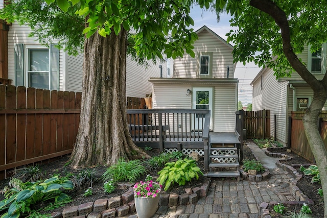 back of property featuring a deck