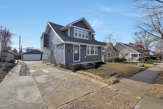 view of front of property featuring an outbuilding and a garage