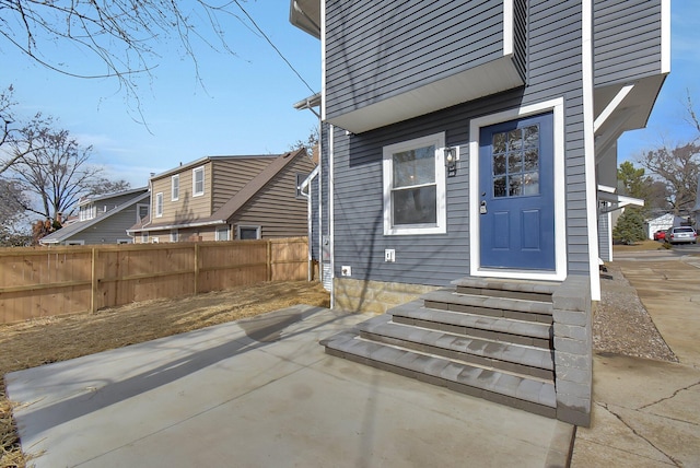 doorway to property with a patio area