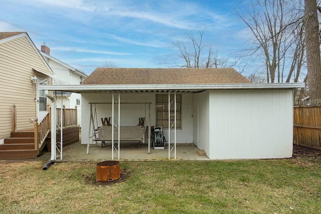 rear view of property featuring a yard and a patio