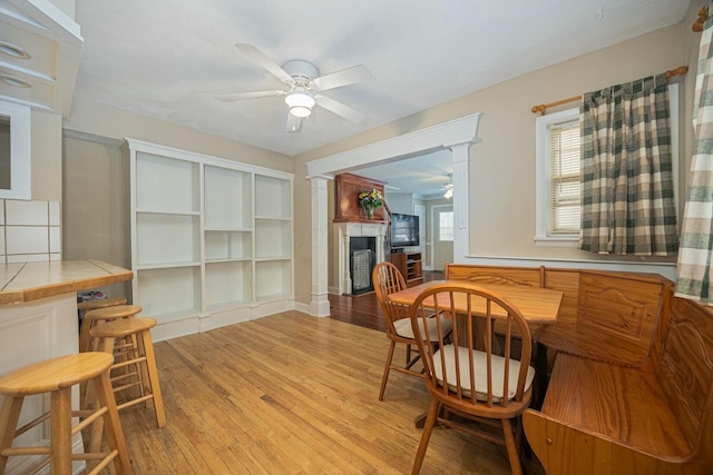 dining area featuring ceiling fan and light hardwood / wood-style flooring