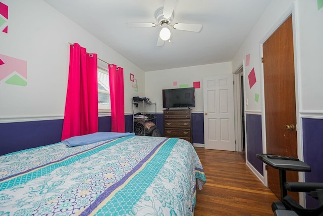 bedroom featuring ceiling fan and dark hardwood / wood-style flooring