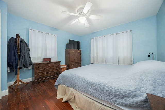 bedroom featuring ceiling fan and dark hardwood / wood-style floors