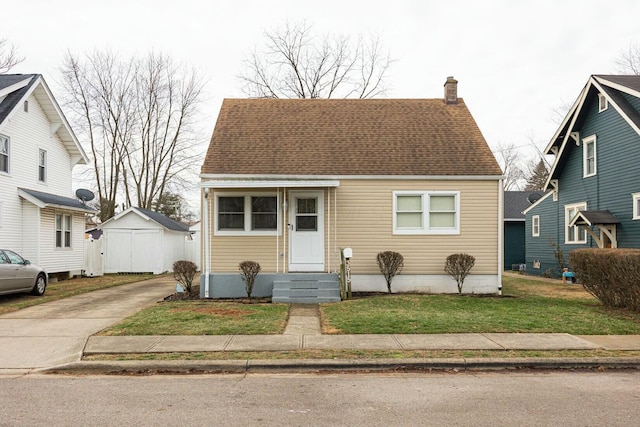 bungalow-style home featuring a front yard