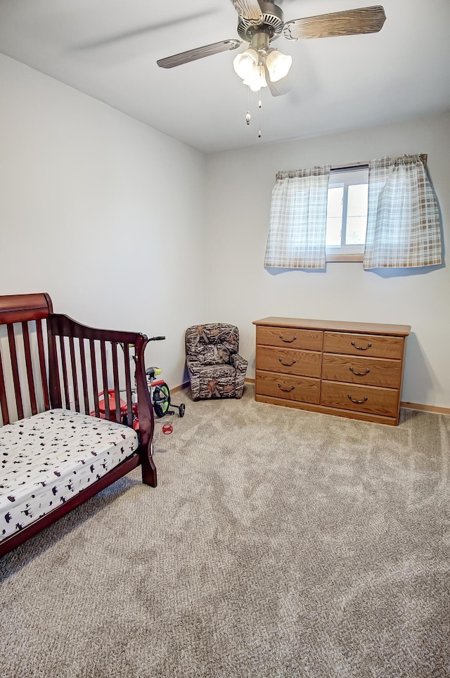 carpeted bedroom with ceiling fan