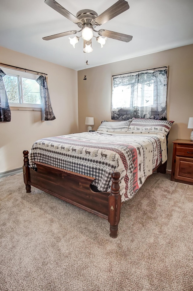 bedroom with light colored carpet and ceiling fan