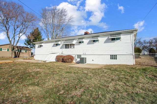 back of property featuring a yard and a patio