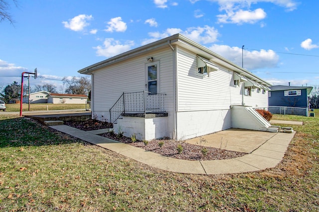 view of property exterior featuring a yard