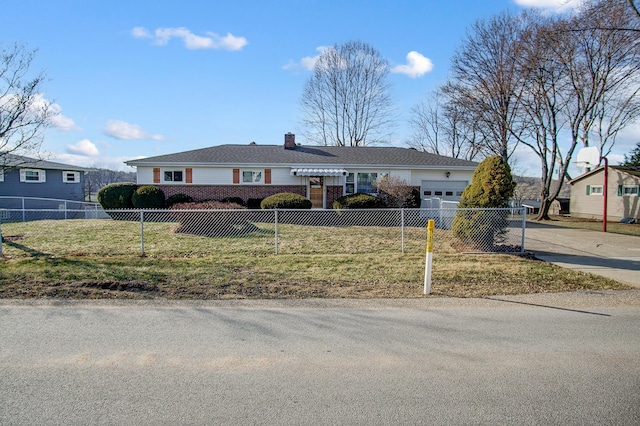 single story home with a garage and a front lawn