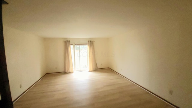 empty room featuring light hardwood / wood-style floors