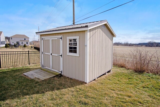 view of outbuilding featuring a yard