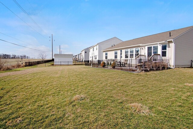 rear view of house featuring a yard