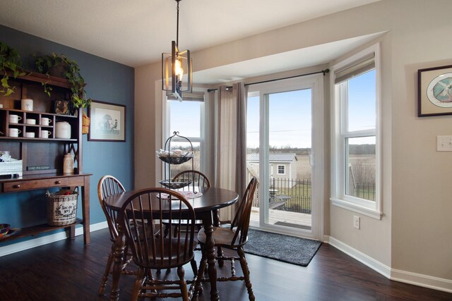 dining area featuring dark hardwood / wood-style floors