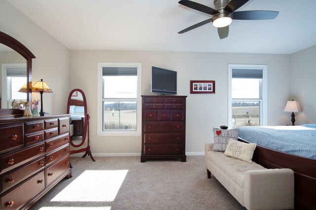 bedroom with ceiling fan and light colored carpet