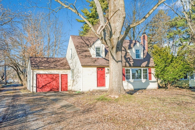 cape cod-style house with a garage