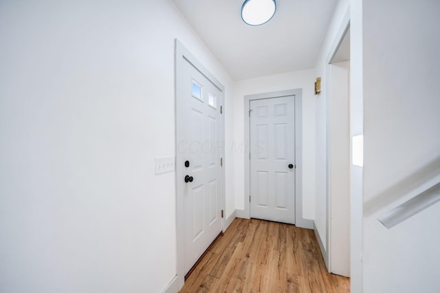 corridor featuring light wood-type flooring