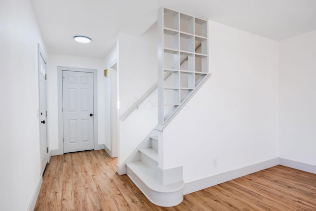 staircase featuring hardwood / wood-style floors