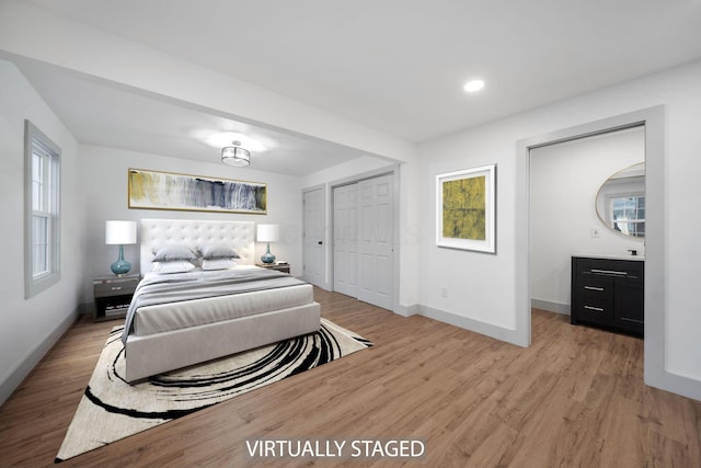 bedroom with light hardwood / wood-style floors