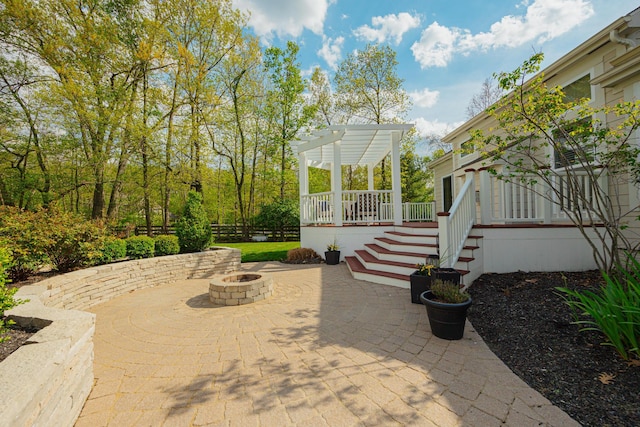 view of patio featuring a pergola and a fire pit