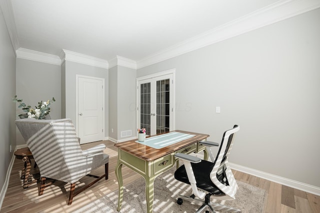 home office with wood-type flooring, ornamental molding, and french doors