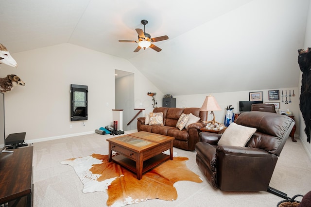 living room featuring lofted ceiling, light colored carpet, and ceiling fan