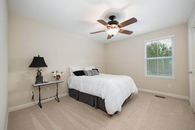 carpeted bedroom featuring ceiling fan