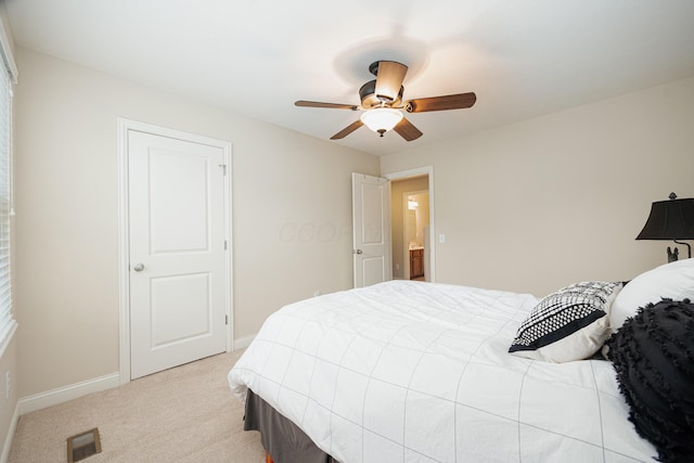 bedroom featuring light colored carpet and ceiling fan