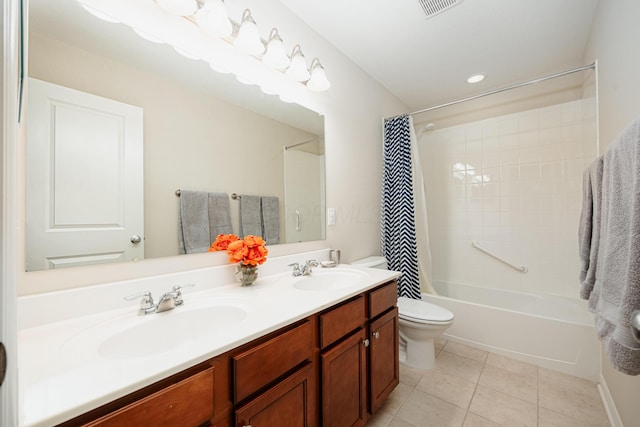 full bathroom featuring vanity, toilet, tile patterned floors, and shower / tub combo with curtain