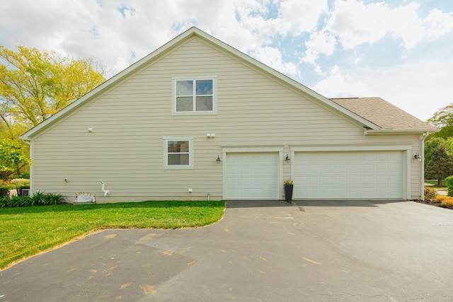 view of side of home with a lawn