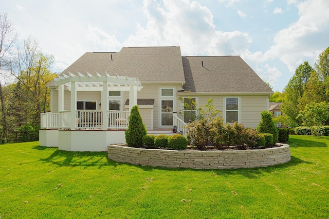 back of property with a pergola and a lawn