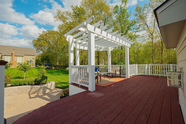 wooden deck with a yard and a pergola