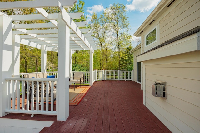 deck featuring a pergola and an outdoor hangout area