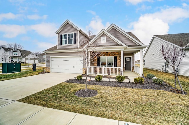 craftsman-style house with a garage, a front yard, and covered porch