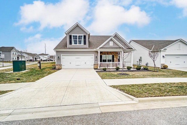 view of front of property with a garage, a front yard, and covered porch