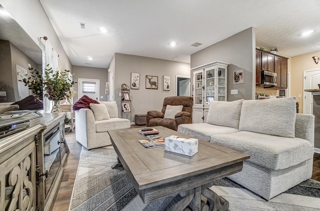 living room with light hardwood / wood-style floors