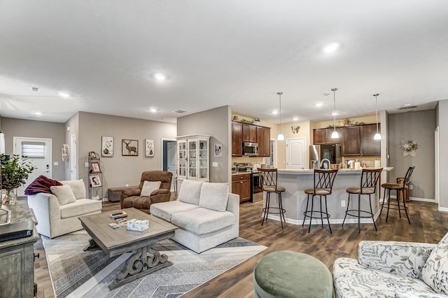 living room featuring dark wood-type flooring