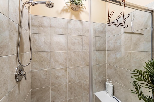 bathroom with tiled shower