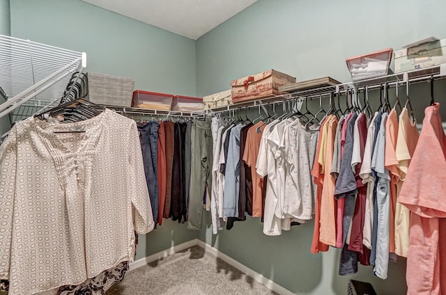 walk in closet featuring carpet