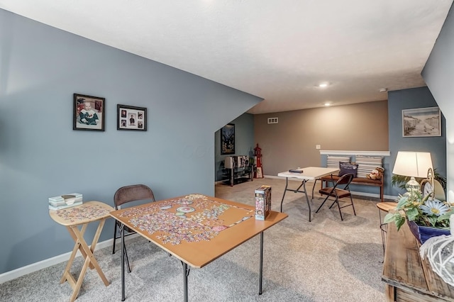 dining room featuring light colored carpet