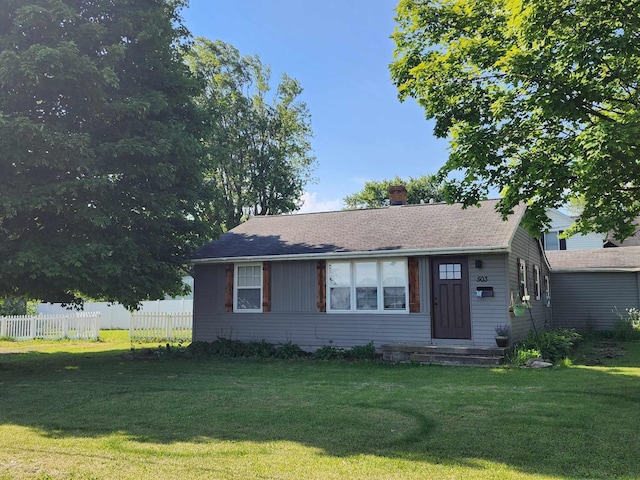 ranch-style house with a front yard