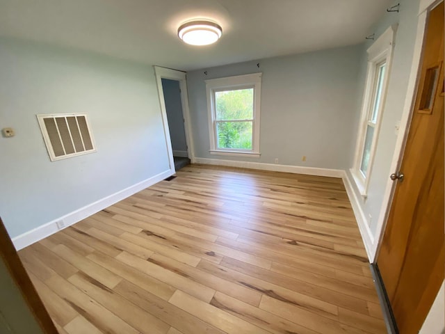 unfurnished bedroom with light wood-type flooring