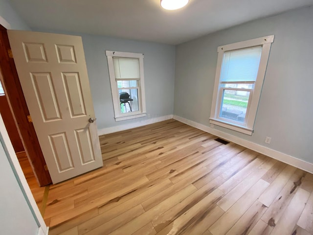 empty room featuring light hardwood / wood-style floors