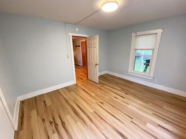 spare room with light hardwood / wood-style floors