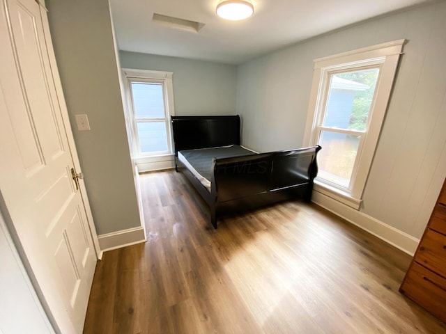 bedroom featuring dark hardwood / wood-style flooring