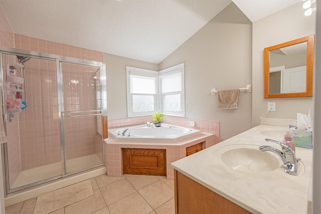 bathroom with vanity, tile patterned floors, independent shower and bath, and lofted ceiling