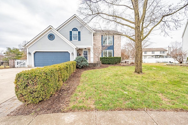 view of front of house featuring a garage and a front lawn