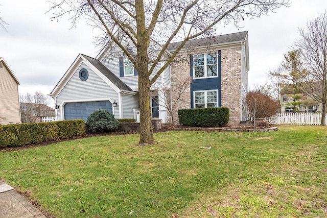 view of front facade with a garage and a front lawn