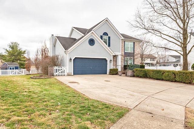 view of property with a garage and a front yard